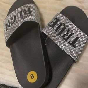Brand new diamond and black True Religion slipper great for a Christmas gift